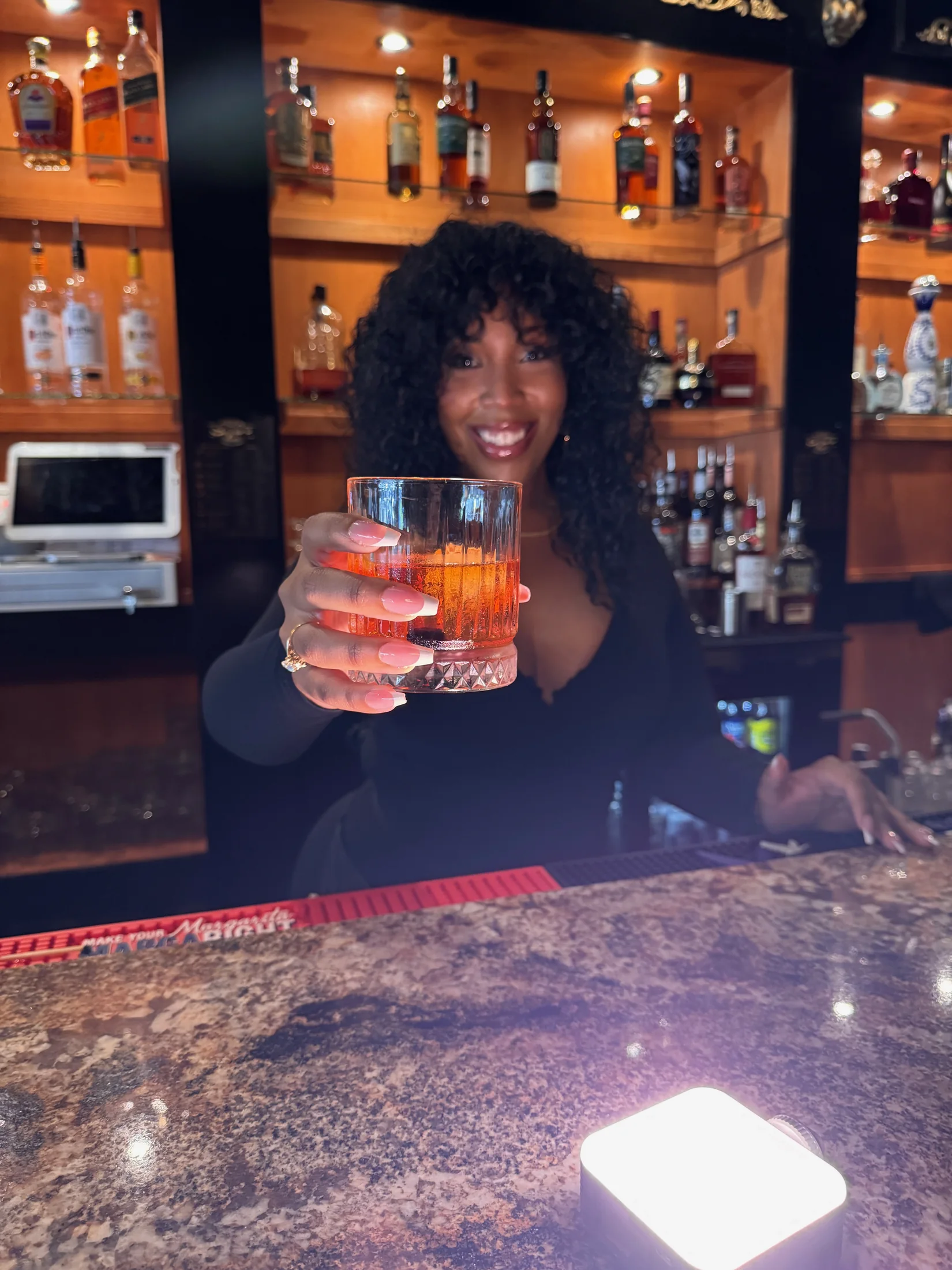 A bartender preparing a cocktail at Sigaro